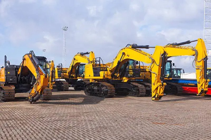 new yellow crawler excavators are parked on the site.